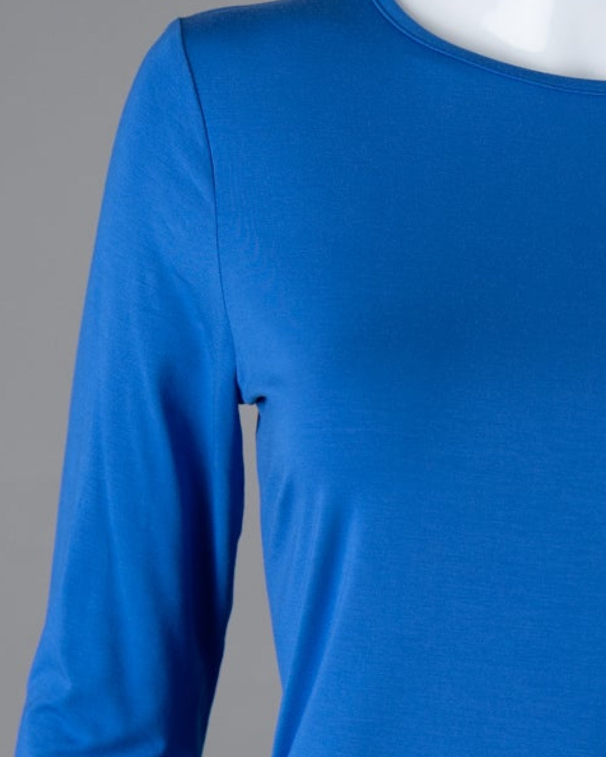 Model wearing Nuggles® 3/4 Essential Tee in Lapiz Blue