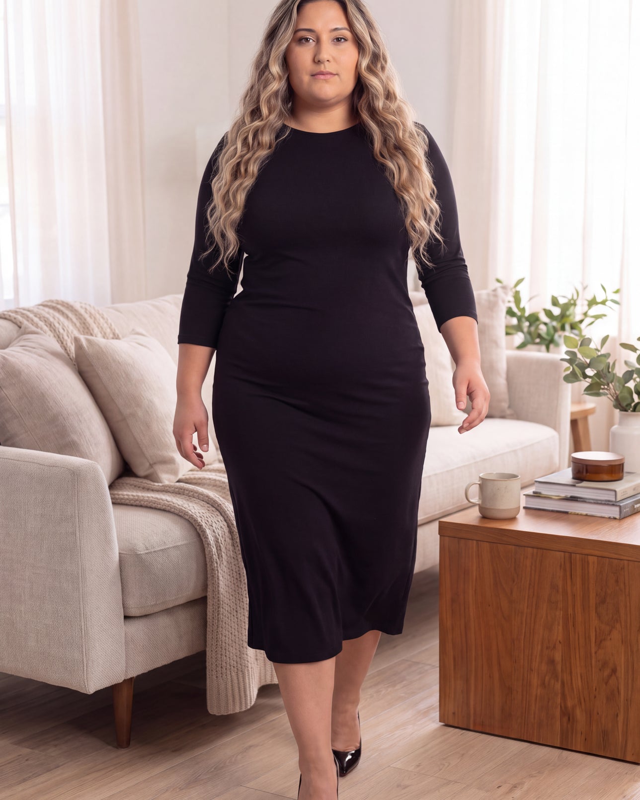 Model wearing Nuggles® MididLayering Dress in Black