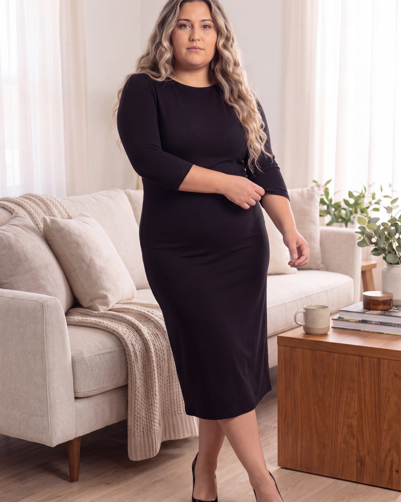 Model wearing Nuggles® MididLayering Dress in Black