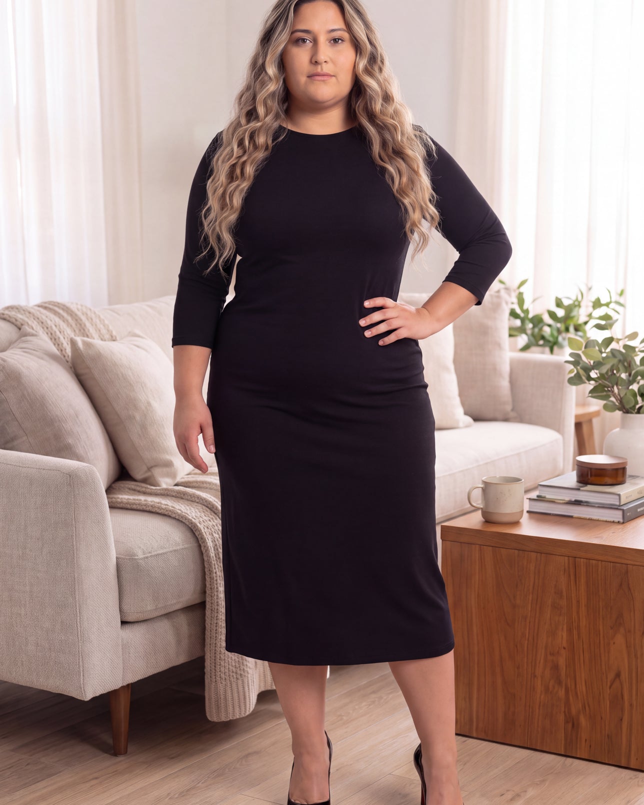 Model wearing Nuggles® MididLayering Dress in Black