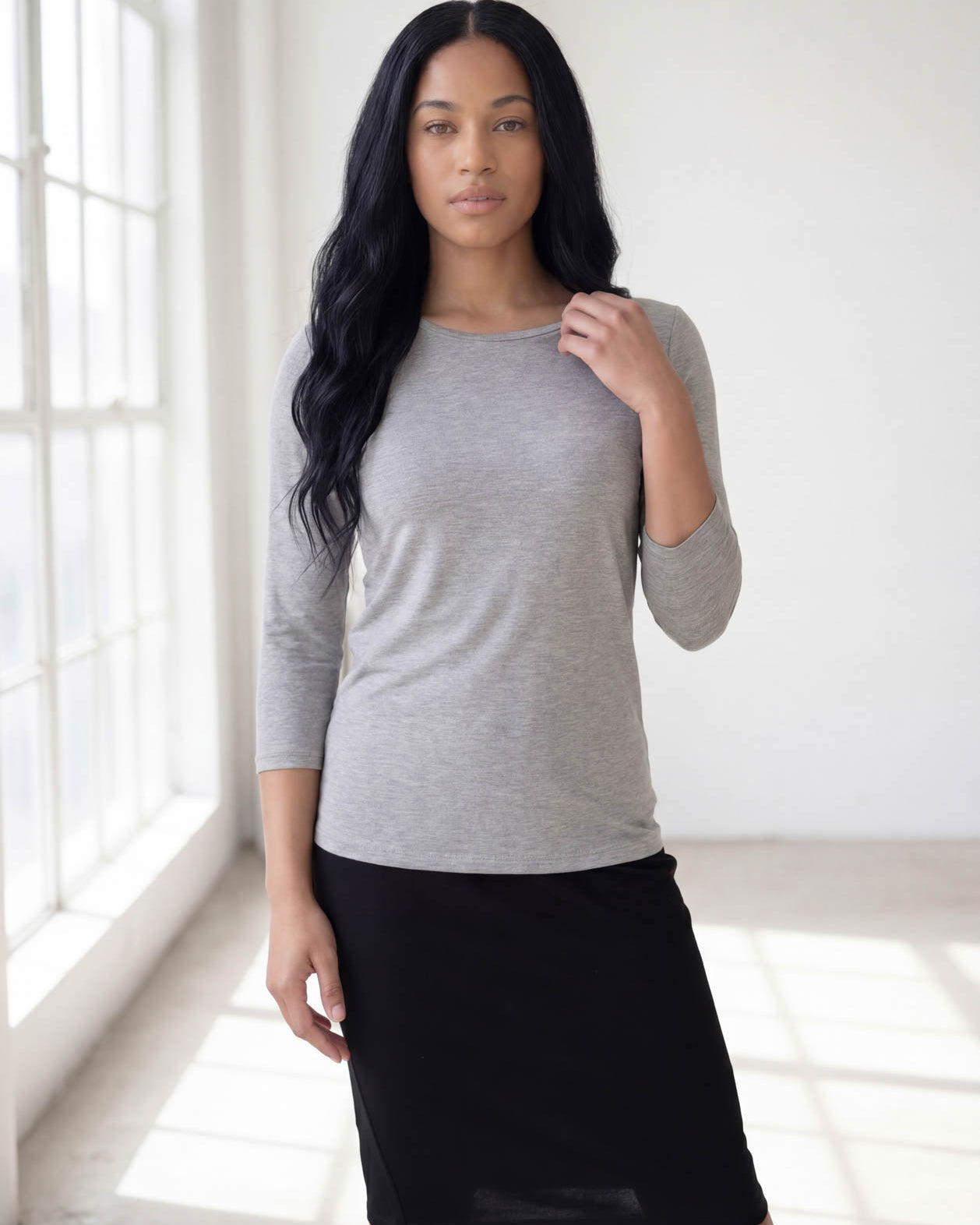 Model wearing Nuggles® 3/4 Essential Tee in Light Heather Gray