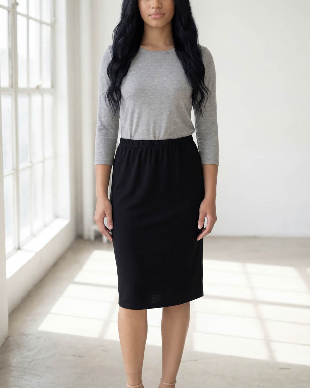 Model wearing Nuggles® 3/4 Essential Tee in Light Heather Gray