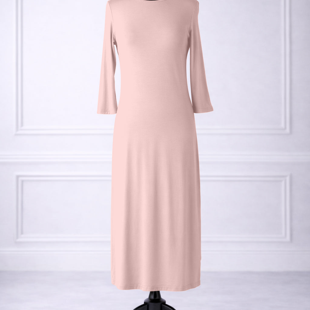 Front view of Nuggles® original midi layering dress in Baby Pink