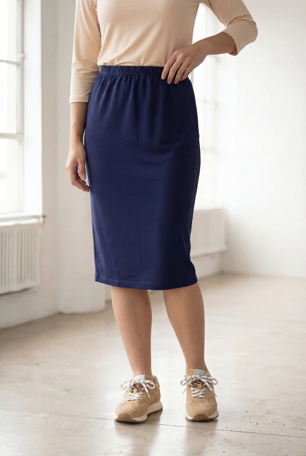 Model wearing Nuggles® 25" Classic Skirt in Navy