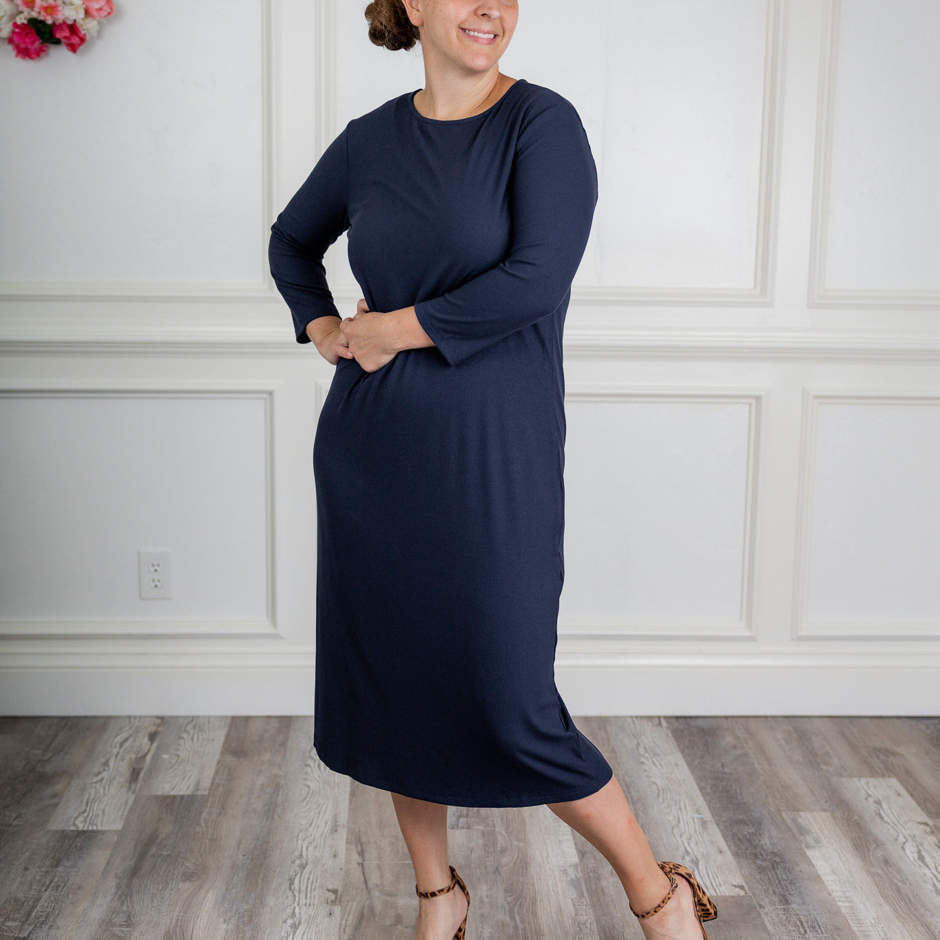 model wearing a ribbed midi dress from Nuggles® with modest 3/4 sleeves and high neckline.