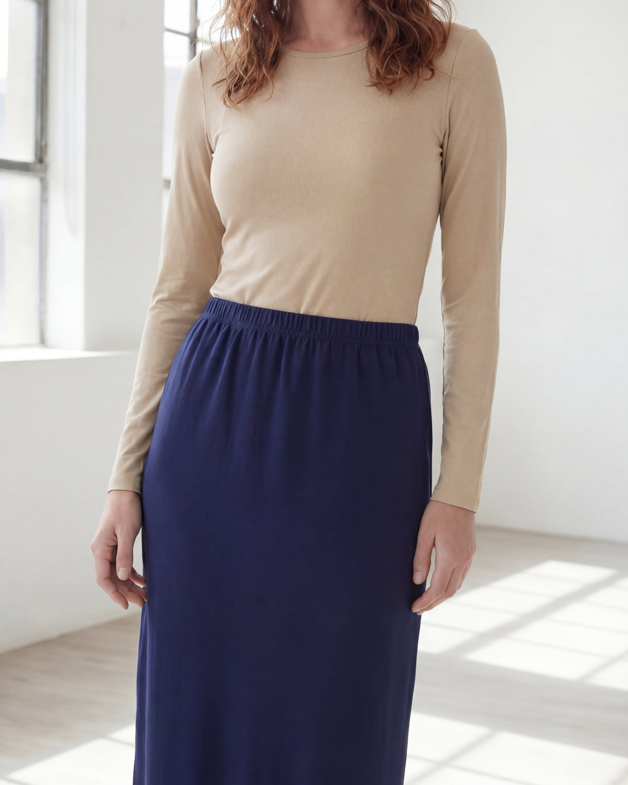 Model wearing Nuggles® 36" Classic Skirt in Navy