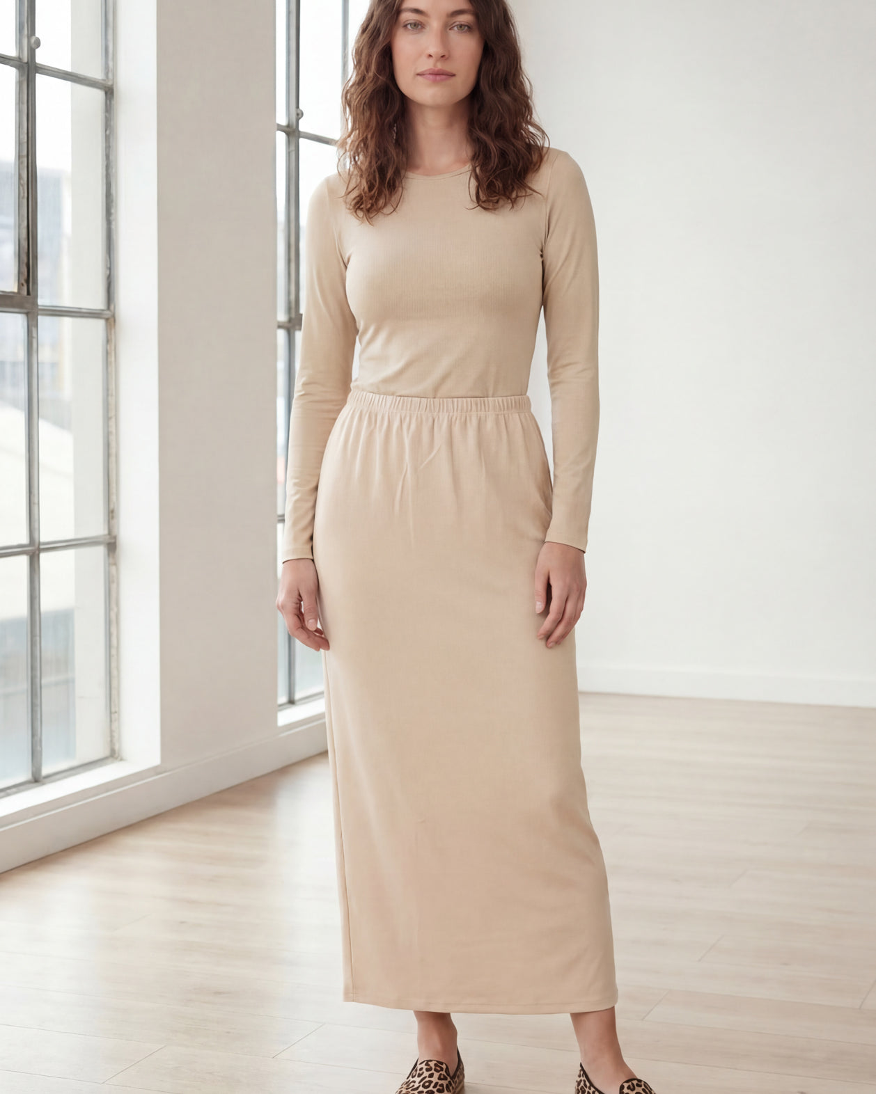 Model wearing Nuggles® 36" Classic Skirt in Nude
