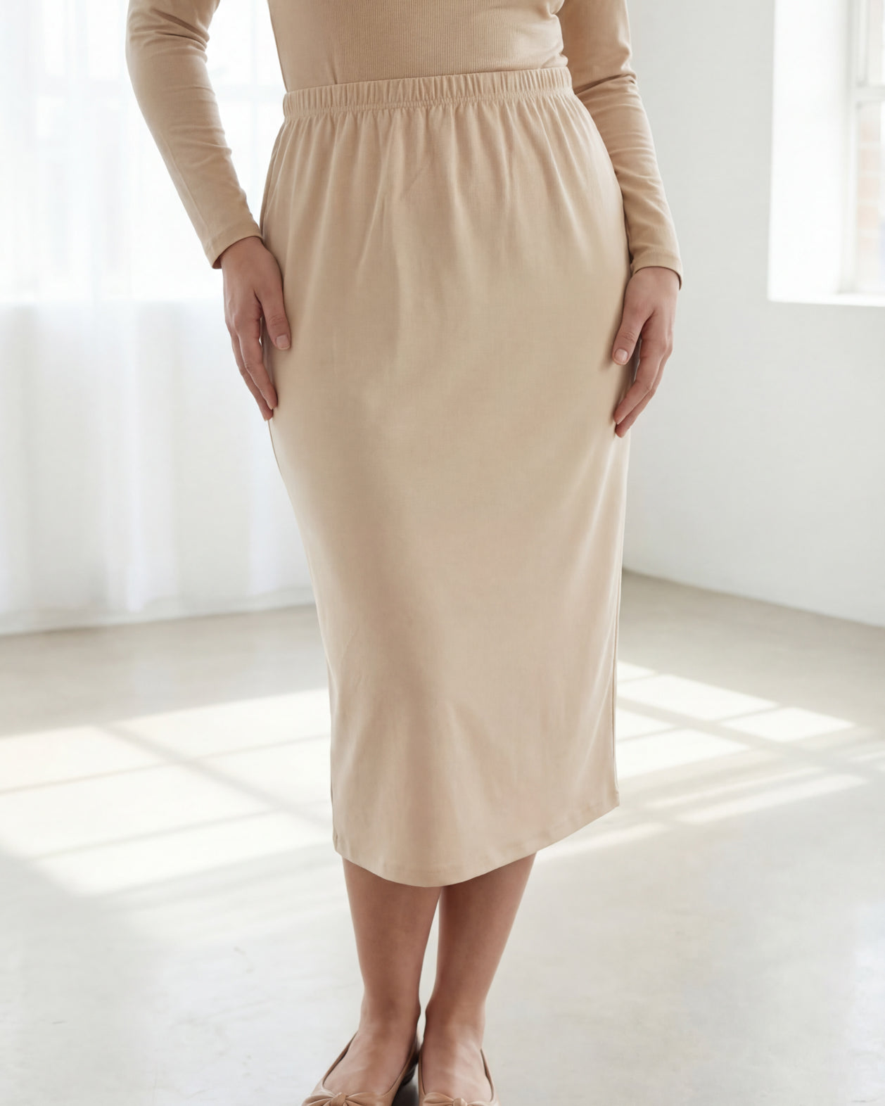 Model wearing Nuggles® 31" Classic Skirt in Nude