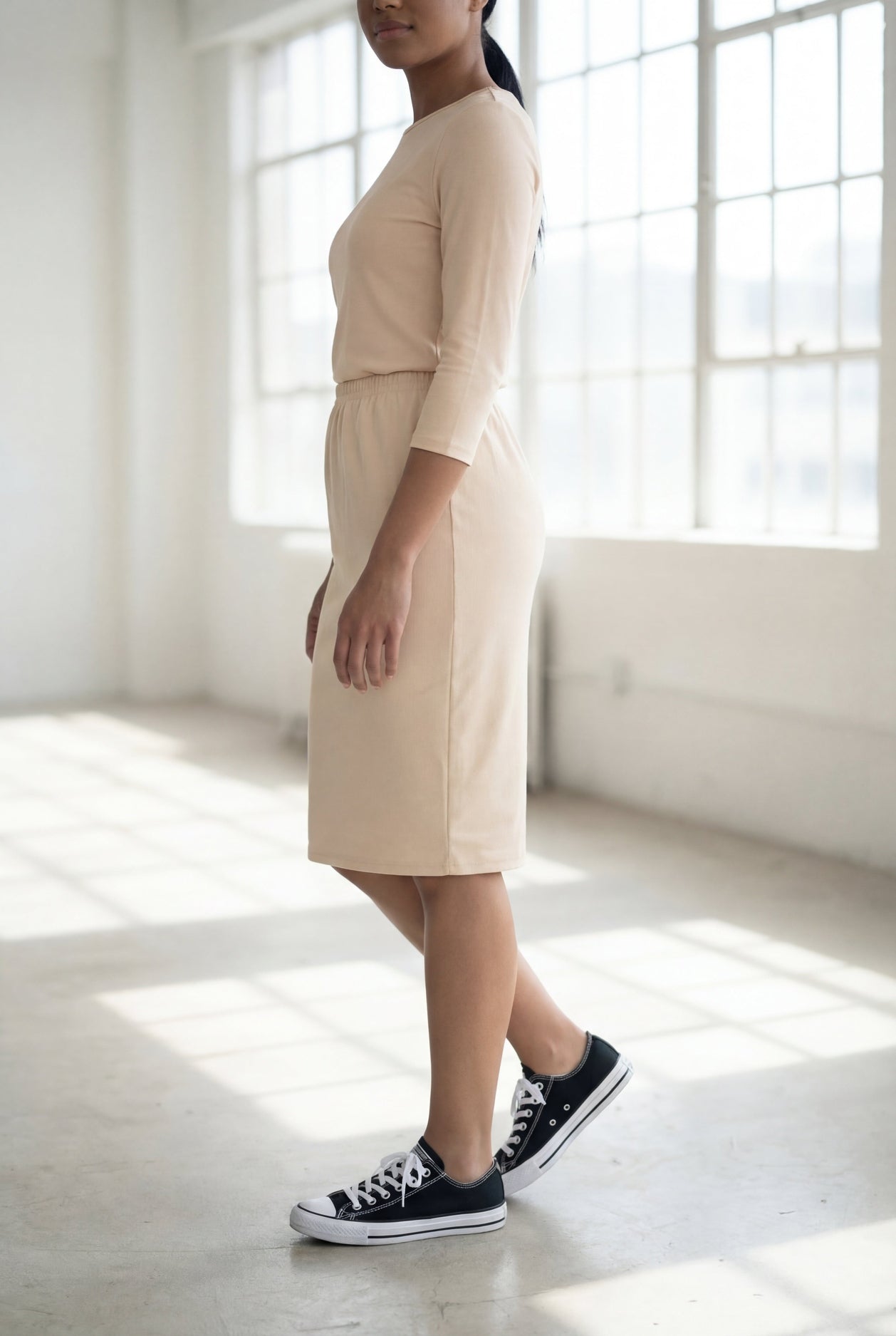 Model wearing Nuggles® 25" Classic Skirt in Nude