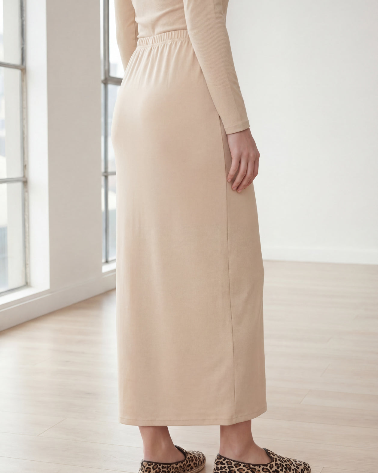 Model wearing Nuggles® 36" Classic Skirt in Nude