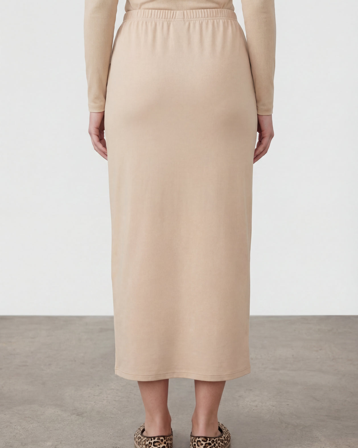 Model wearing Nuggles® 36" Classic Skirt in Nude