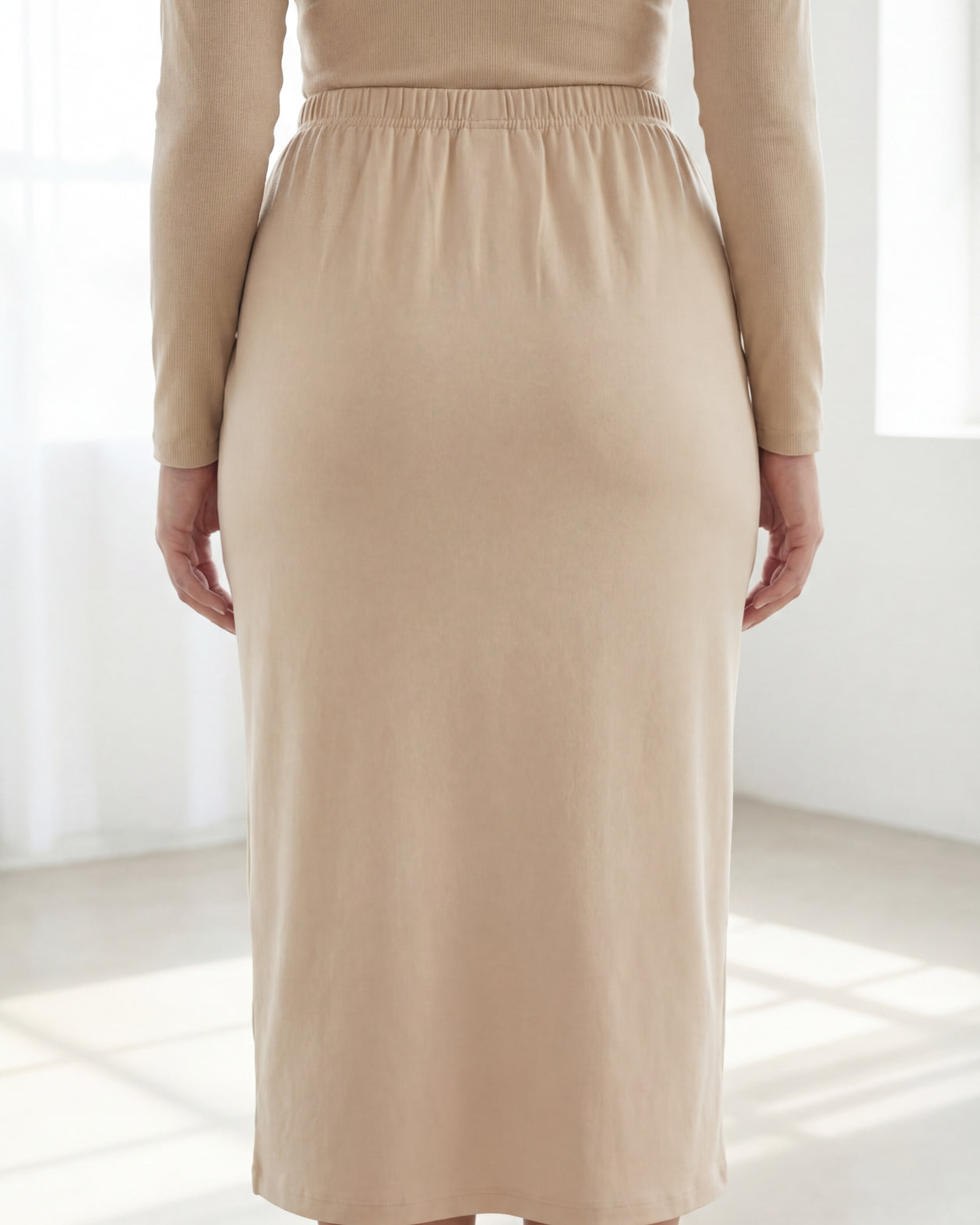 Model wearing Nuggles® 31" Classic Skirt in Nude