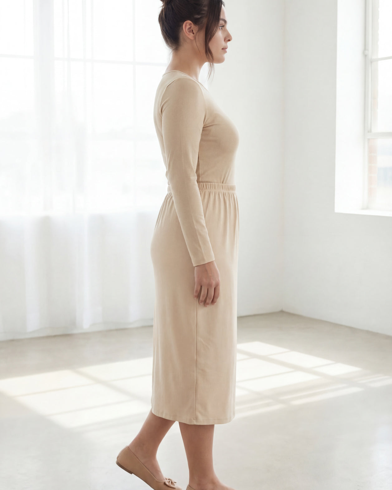 Model wearing Nuggles® 31" Classic Skirt in Nude