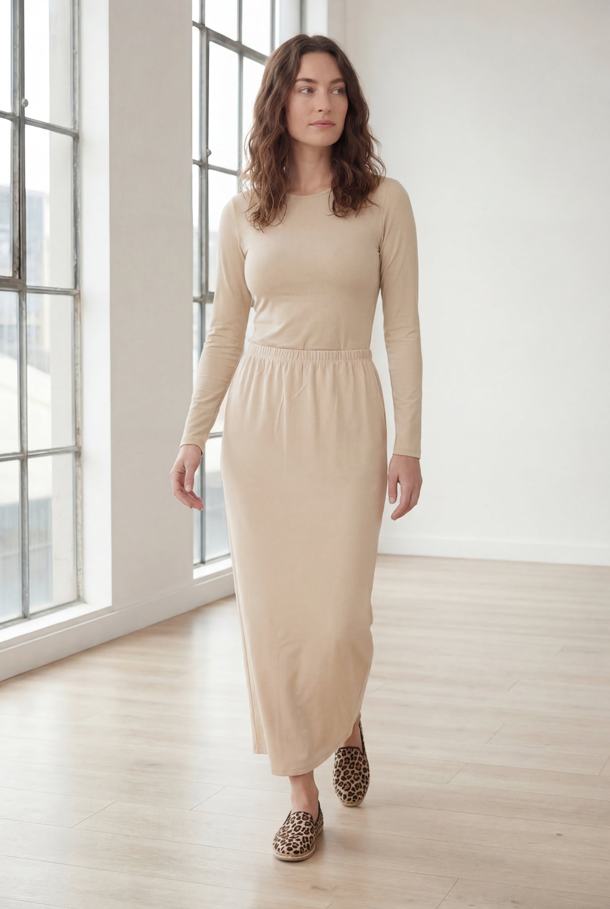 Model wearing Nuggles® 36" Classic Skirt in Nude