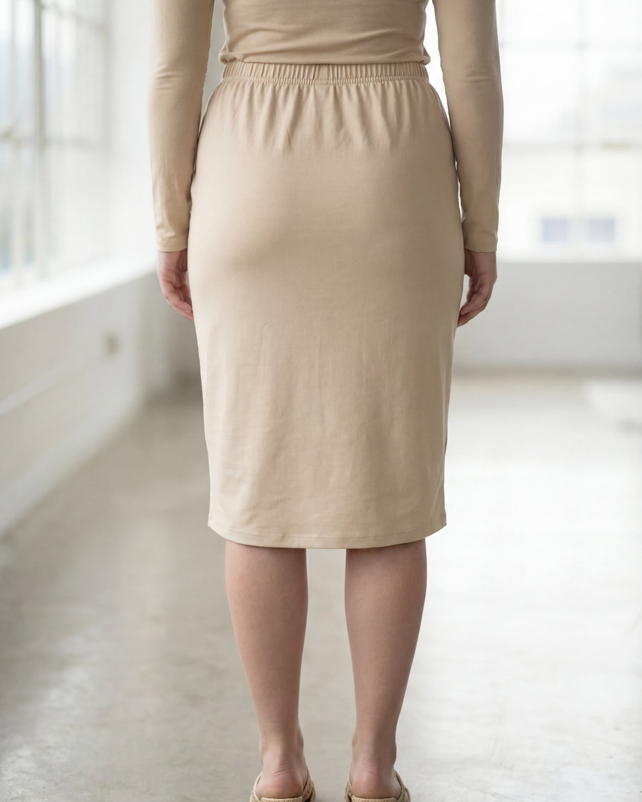 Model wearing Nuggles® 27" Classic Skirt in Nude