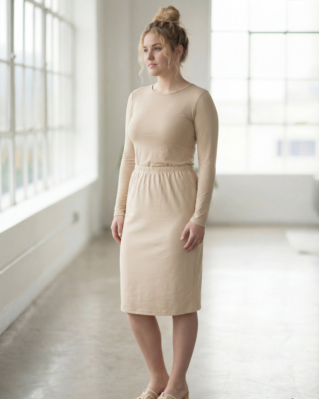 Model wearing Nuggles® 27" Classic Skirt in Nude