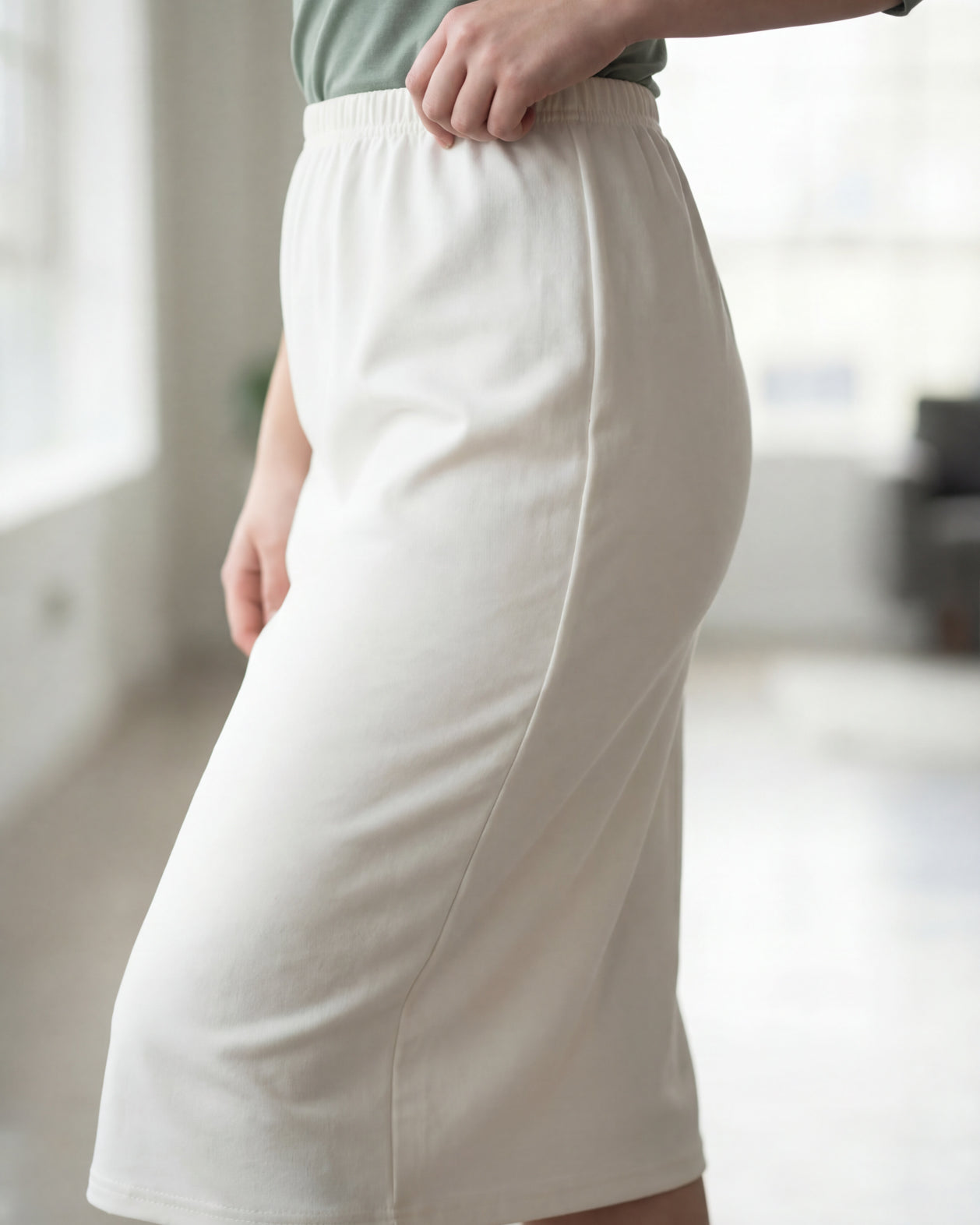 Model wearing Nuggles® 27" Classic Skirt in Off White