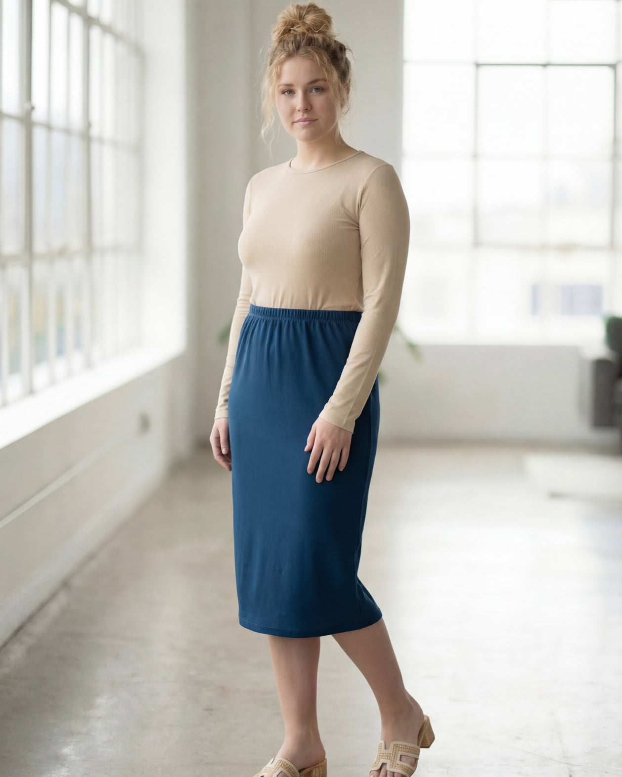 Model wearing Nuggles® 27" Classic Skirt in Peacock Blue