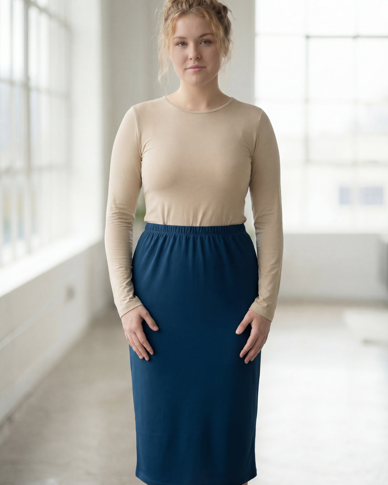 Model wearing Nuggles® 27" Classic Skirt in Peacock Blue