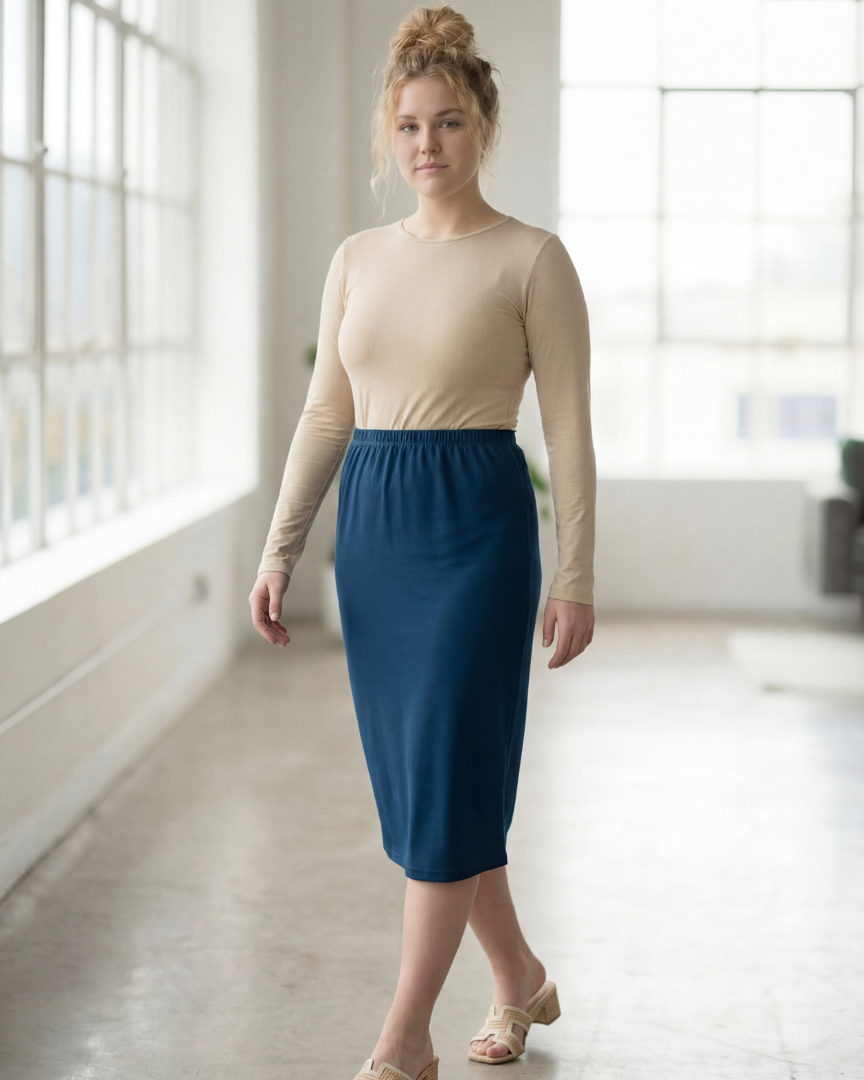 Model wearing Nuggles® 27" Classic Skirt in Peacock Blue