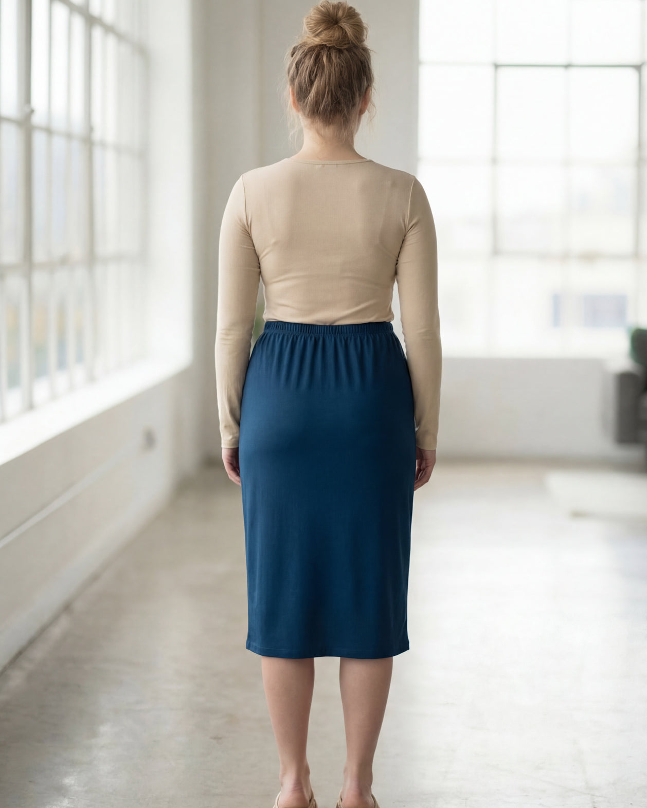 Model wearing Nuggles® 27" Classic Skirt in Peacock Blue