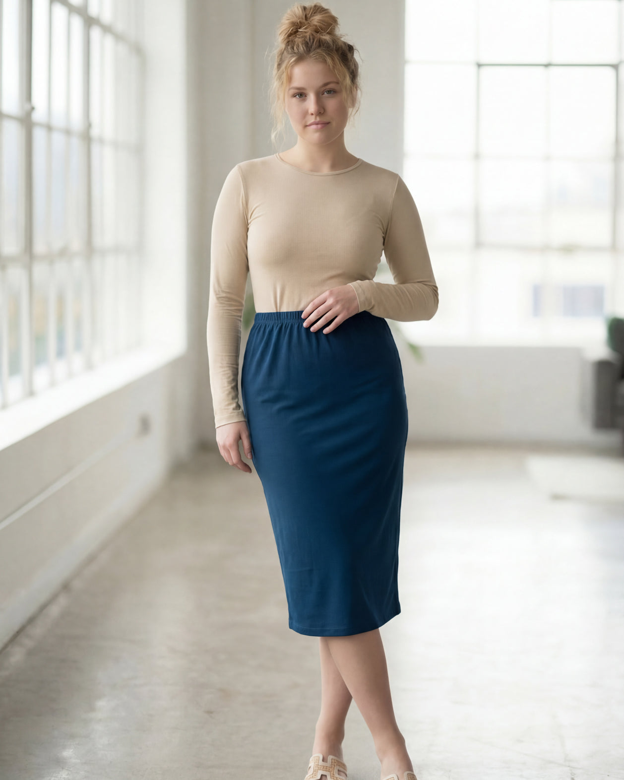 Model wearing Nuggles® 27" Classic Skirt in Peacock Blue