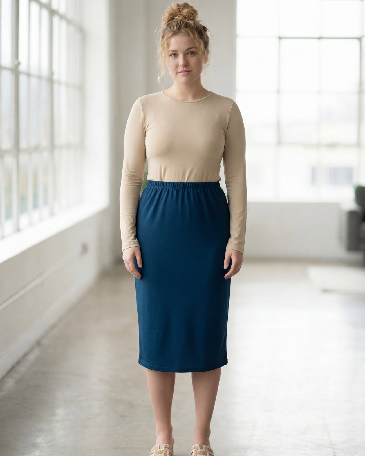 Model wearing Nuggles® 27" Classic Skirt in Peacock Blue