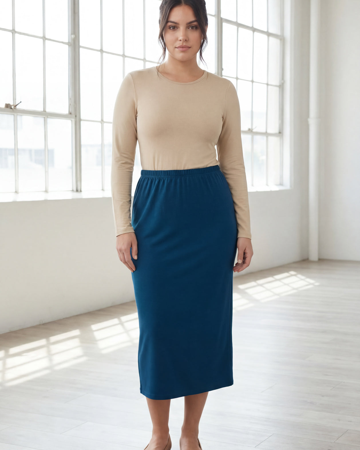 Model wearing Nuggles® 31" Classic Skirt in Peacock Blue