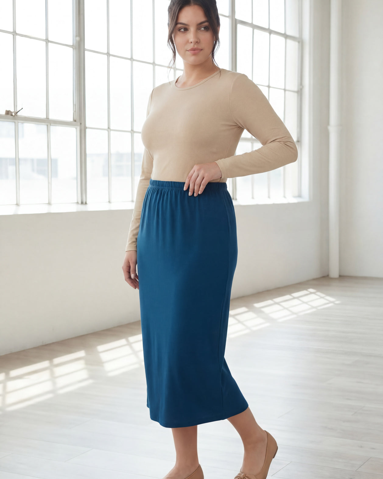 Model wearing Nuggles® 31" Classic Skirt in Peacock Blue