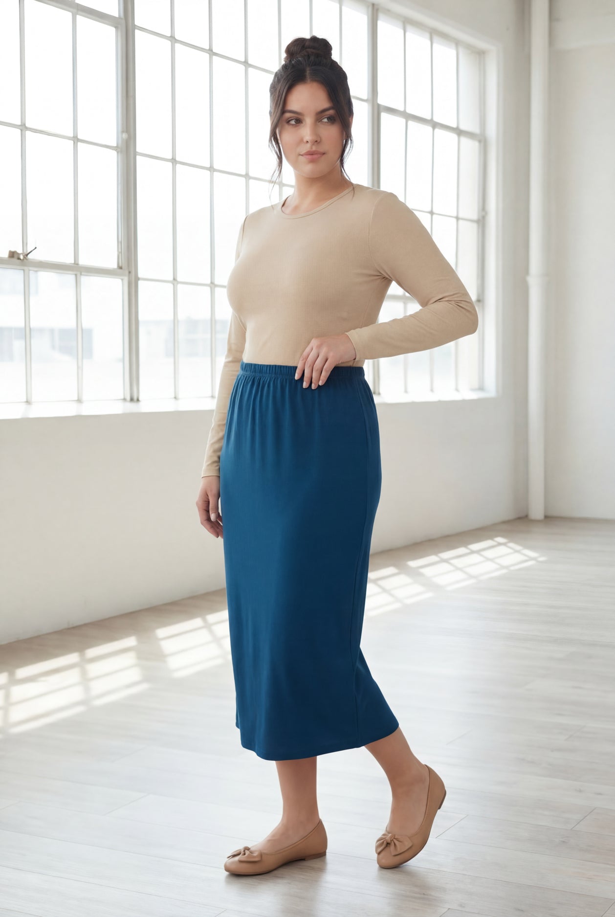 Model wearing Nuggles® 31" Classic Skirt in Peacock Blue
