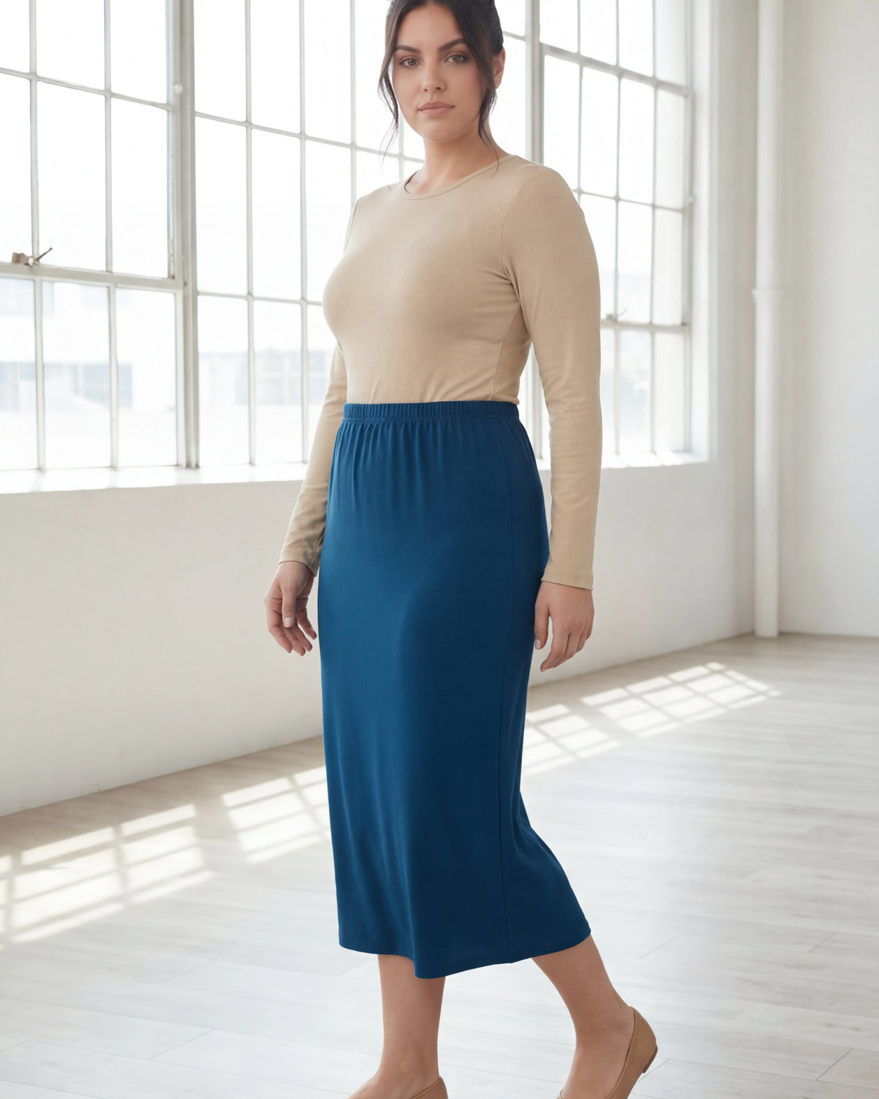 Model wearing Nuggles® 31" Classic Skirt in Peacock Blue