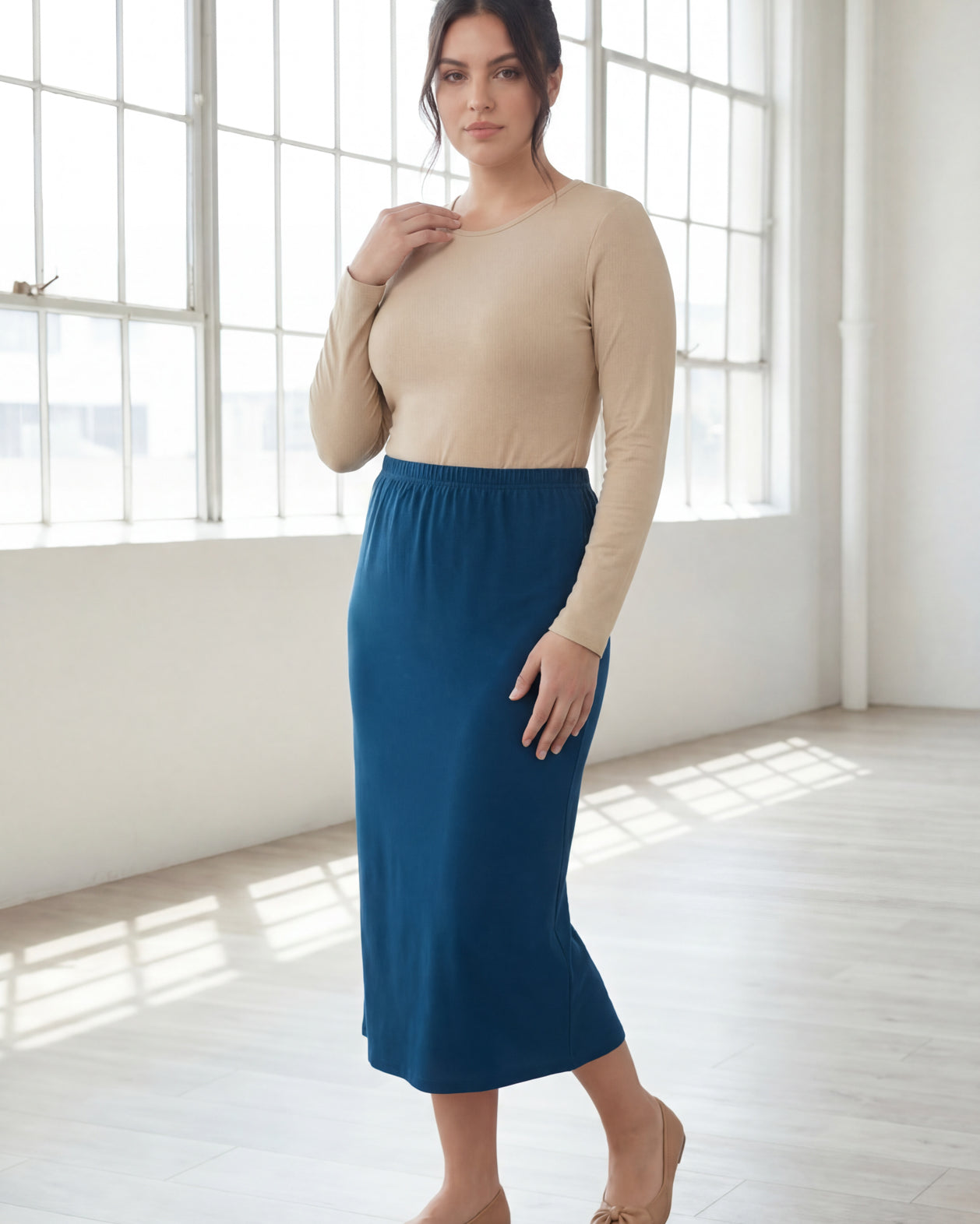 Model wearing Nuggles® 31" Classic Skirt in Peacock Blue