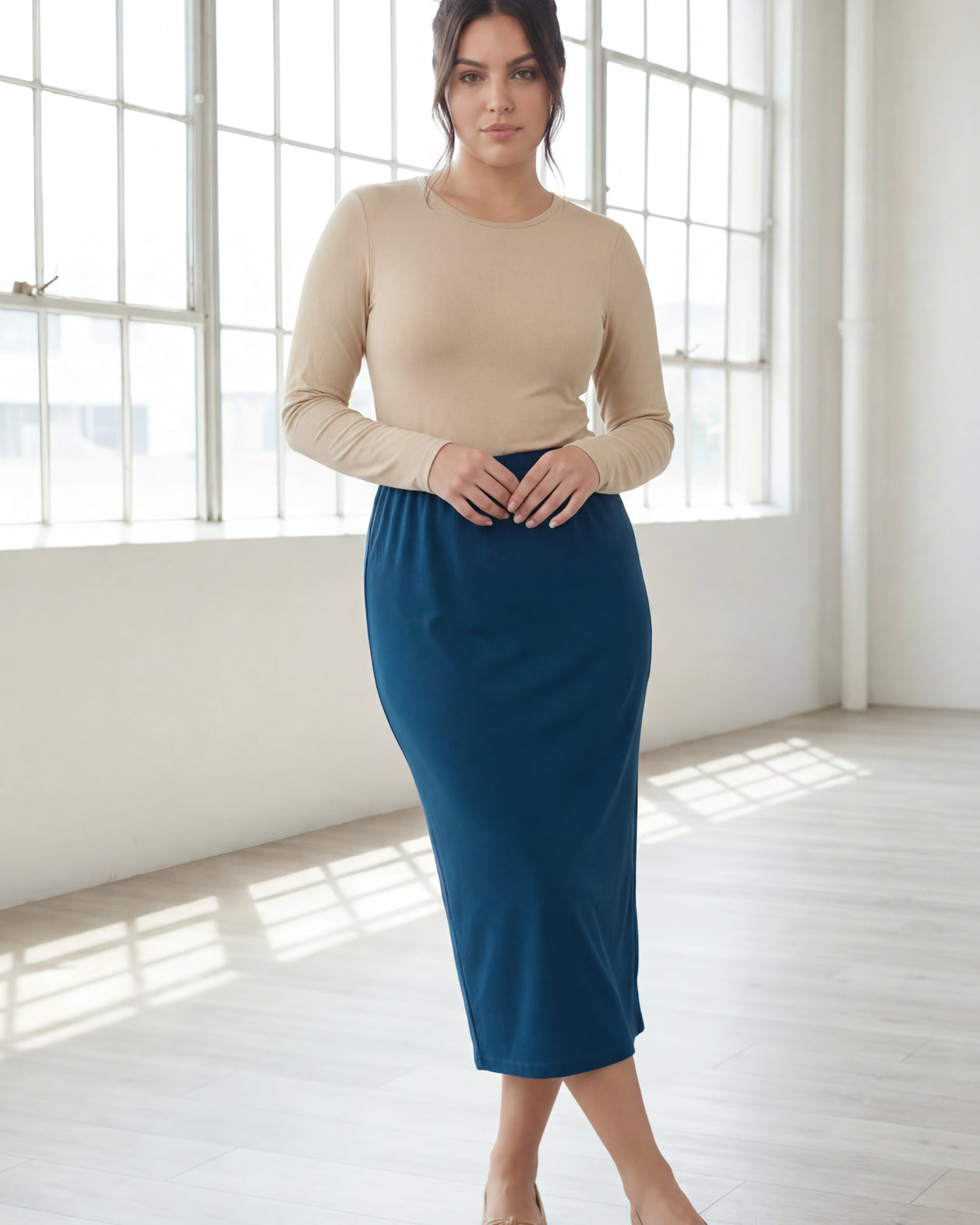 Model wearing Nuggles® 31" Classic Skirt in Peacock Blue