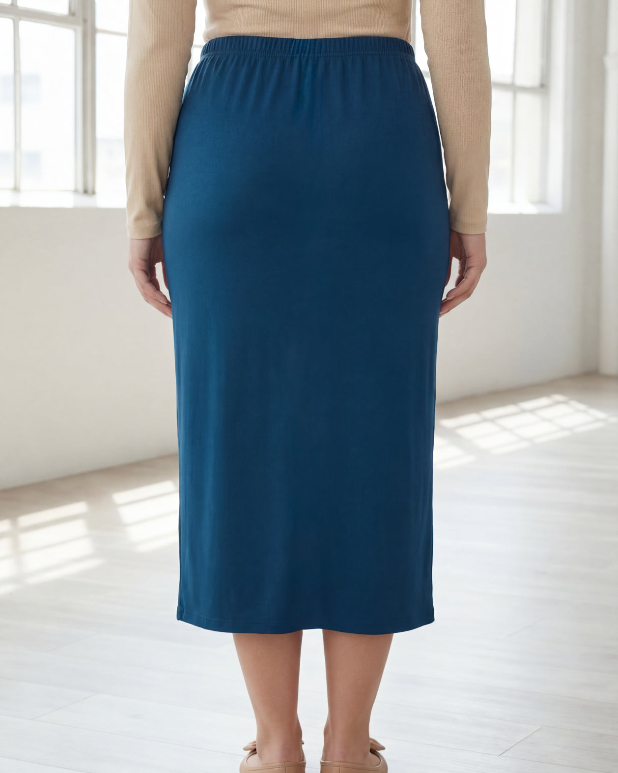 Model wearing Nuggles® 31" Classic Skirt in Peacock Blue