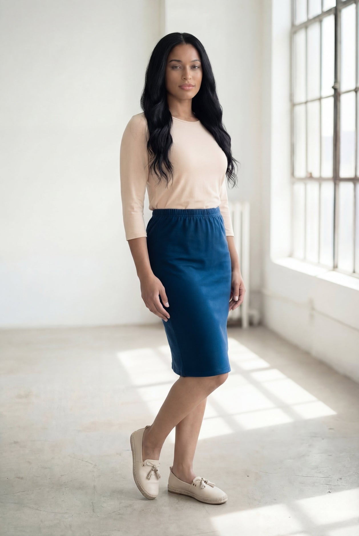Model wearing Nuggles® 25" Classic Skirt in Peacock Blue