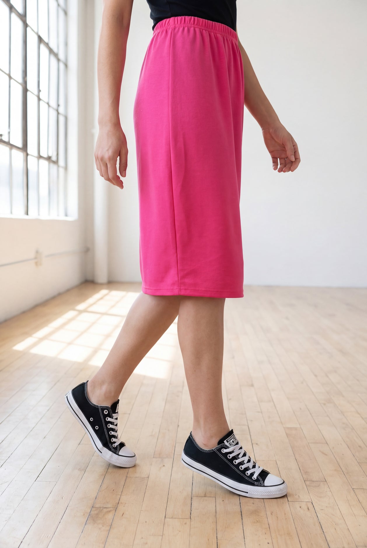 Model wearing Nuggles® 25" Classic Skirt in Pink