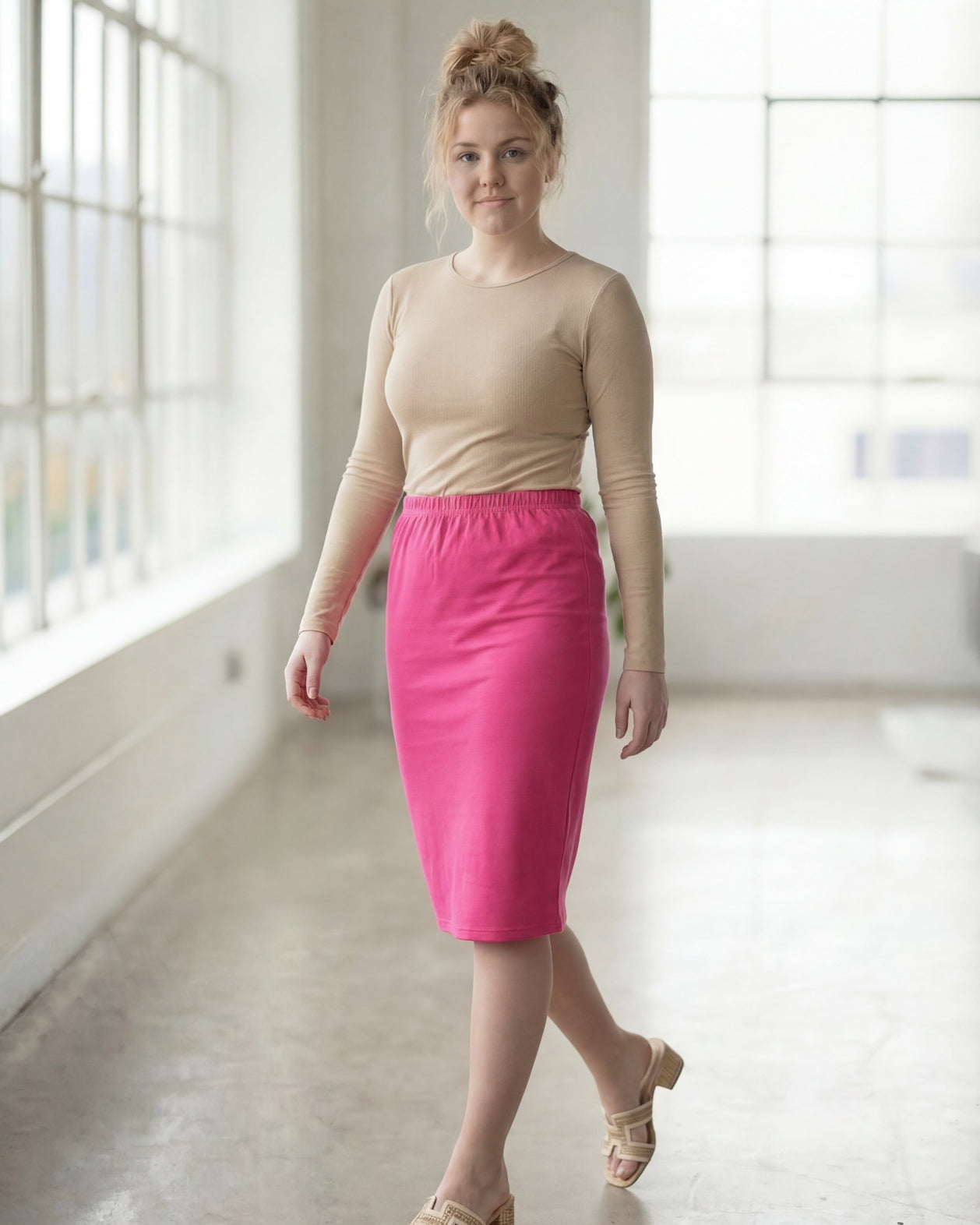 Model wearing Nuggles® 27" Classic Skirt in Pink