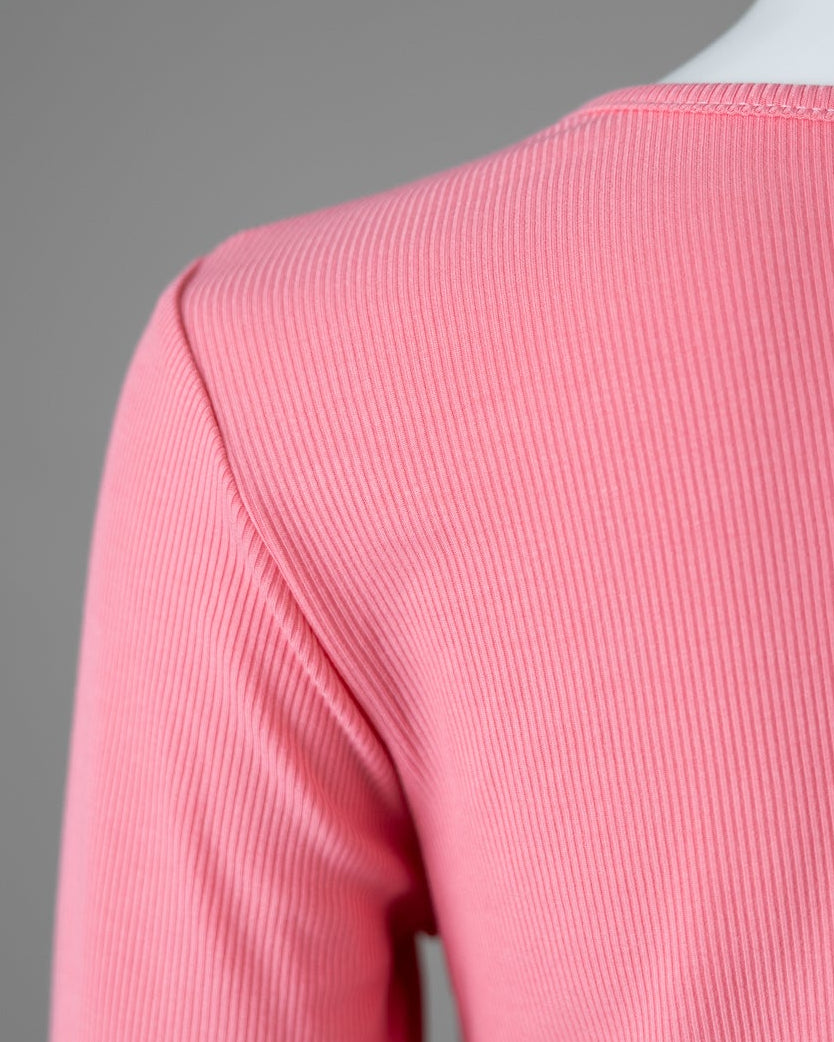 Model wearing Nuggles® 3/4 Essential Ribbed Tee in Pink