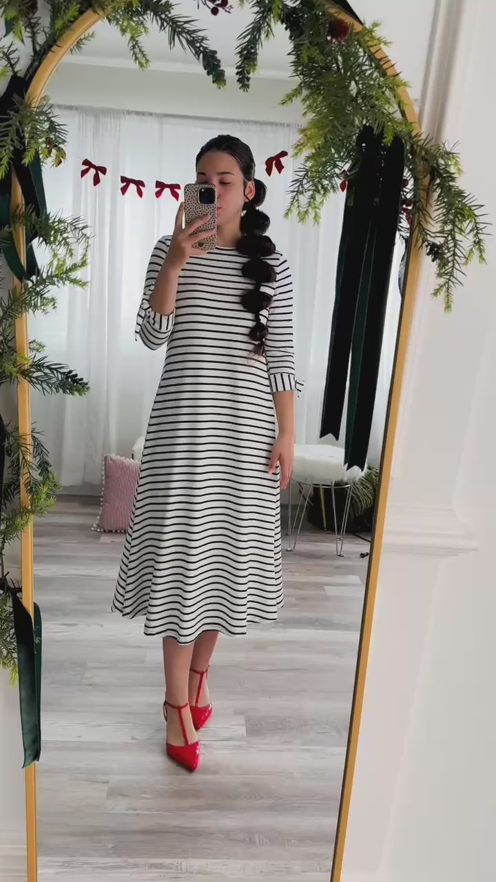 Try-on video showcasing the Nuggles®  Gracie Dress in multiple colors and sizes, highlighting its modest A-line fit and comfort.