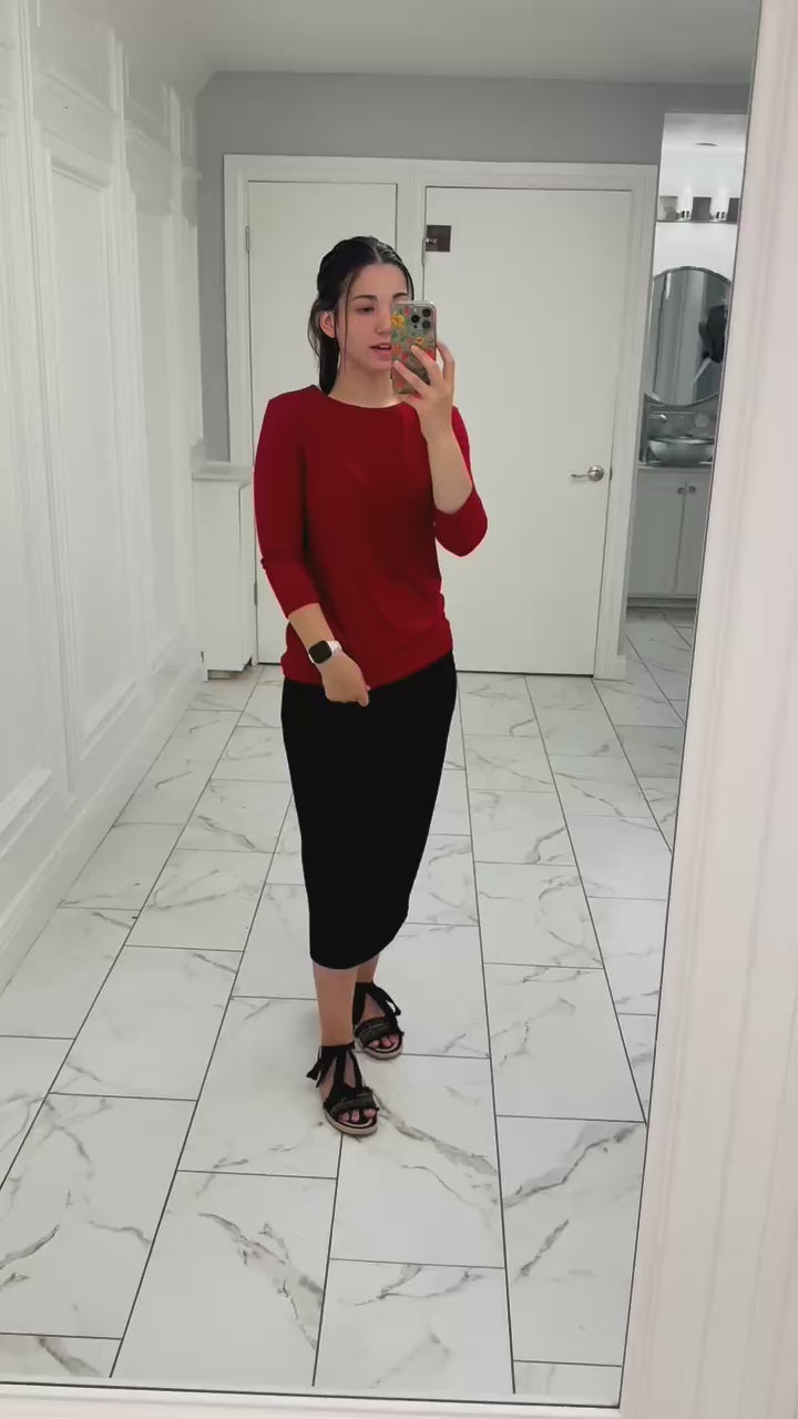 Video of model wearing the Nuggles® Essential 3/4 Tee in ribbed fabric, showcasing fit, stretch, and movement. Modest, fitted design with 3/4 sleeves—perfect for layering year-round.