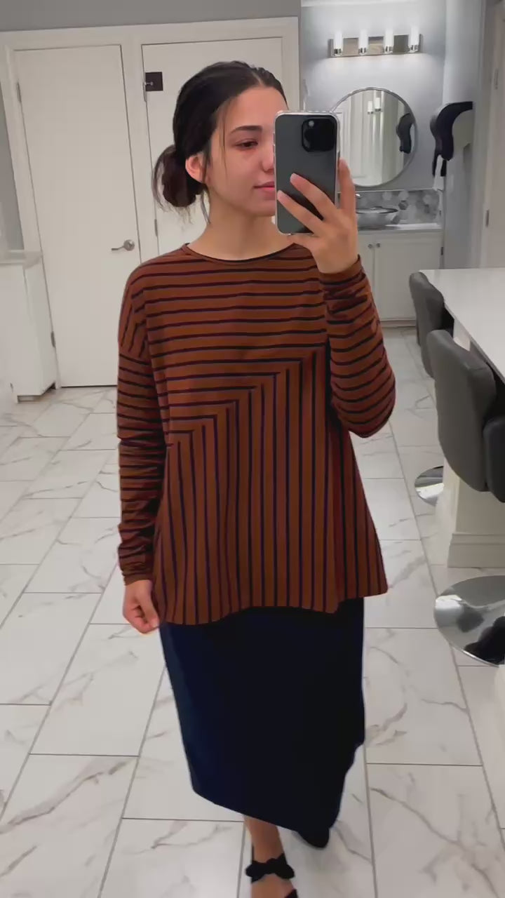 Model showcasing the comfortable stretch and flattering silhouette of the Nuggles® Indy Top