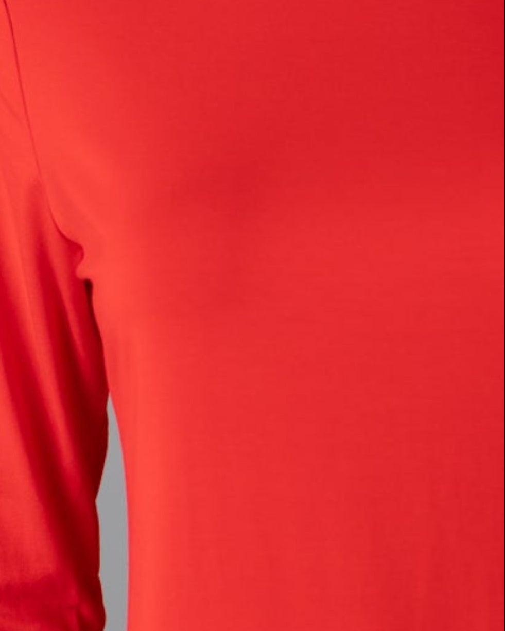 Model wearing Nuggles® 3/4 Essential Tee in Red