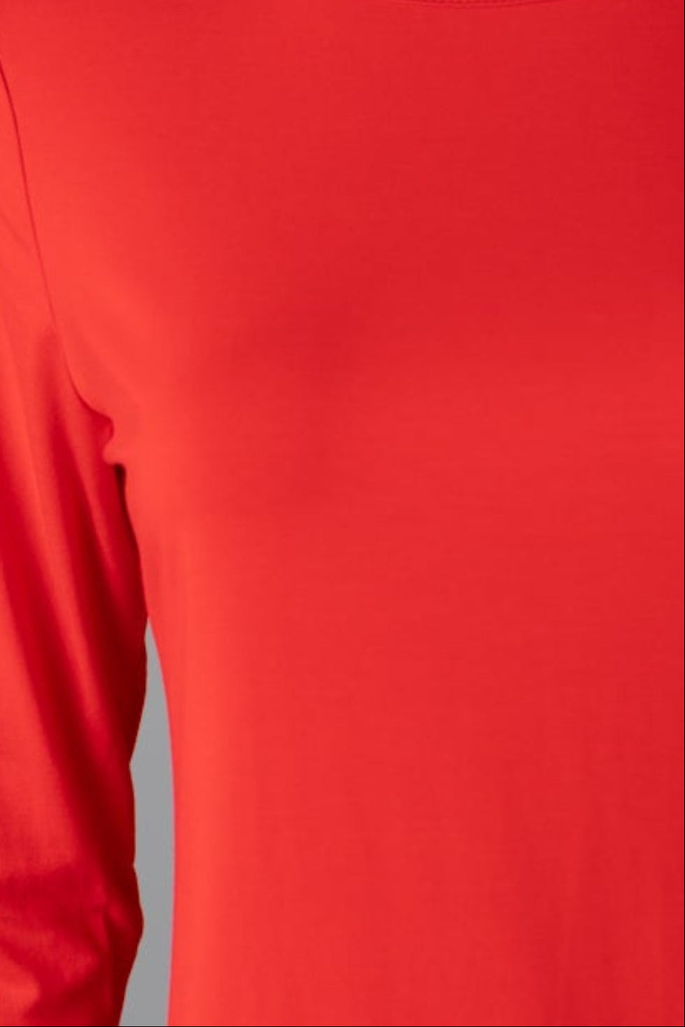 Model wearing Nuggles® 3/4 Essential Tee in Red