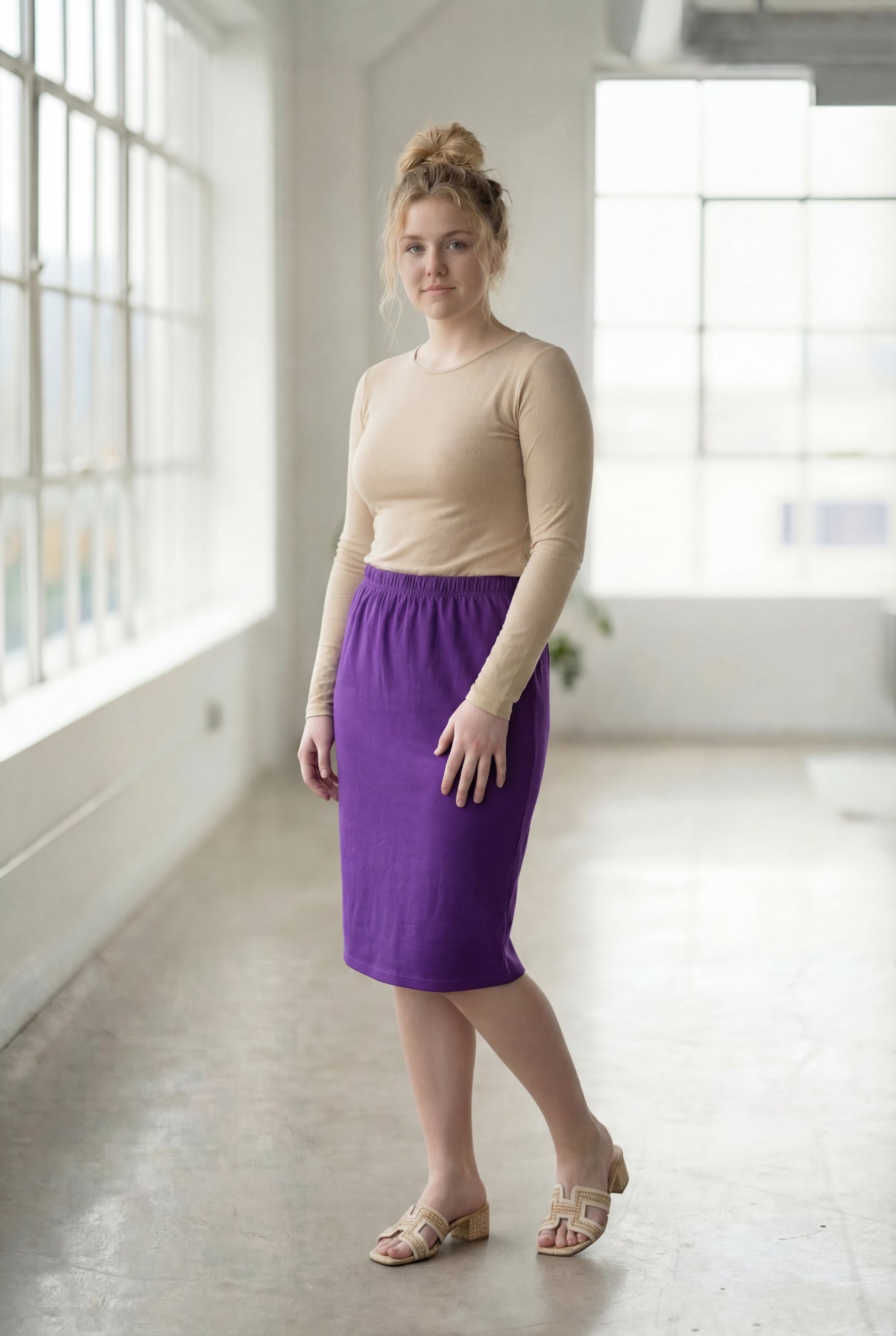 Model wearing Nuggles® 27" Classic Skirt in Royal Purple