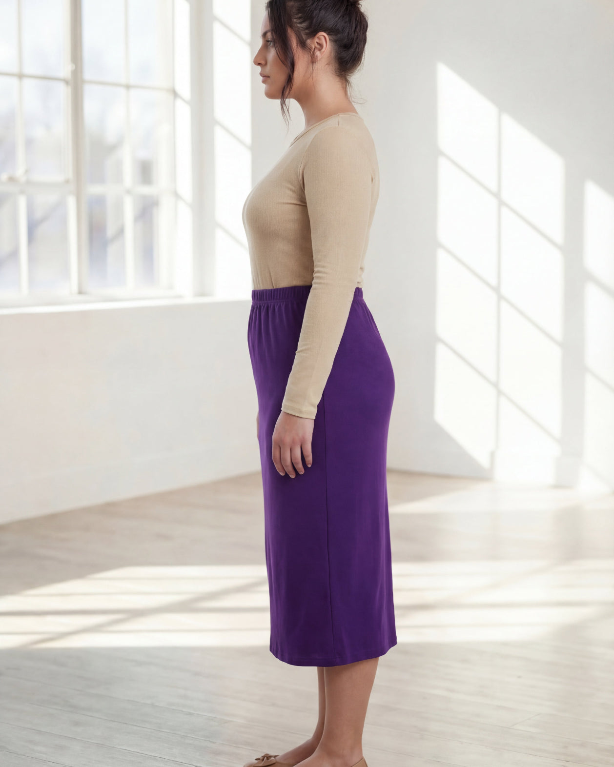 Model wearing Nuggles® 31" Classic Skirt in Royal Purple