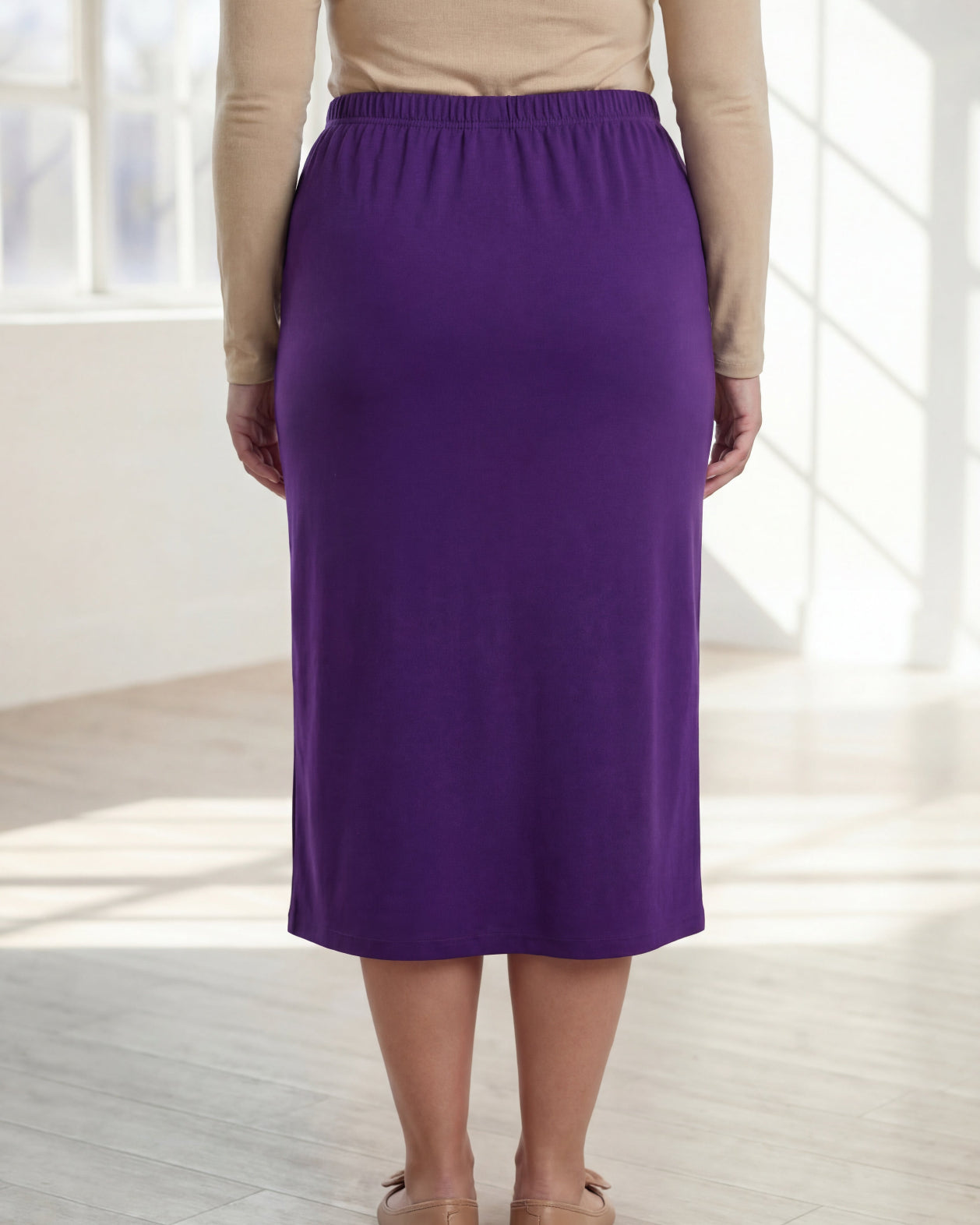 Model wearing Nuggles® 31" Classic Skirt in Royal Purple