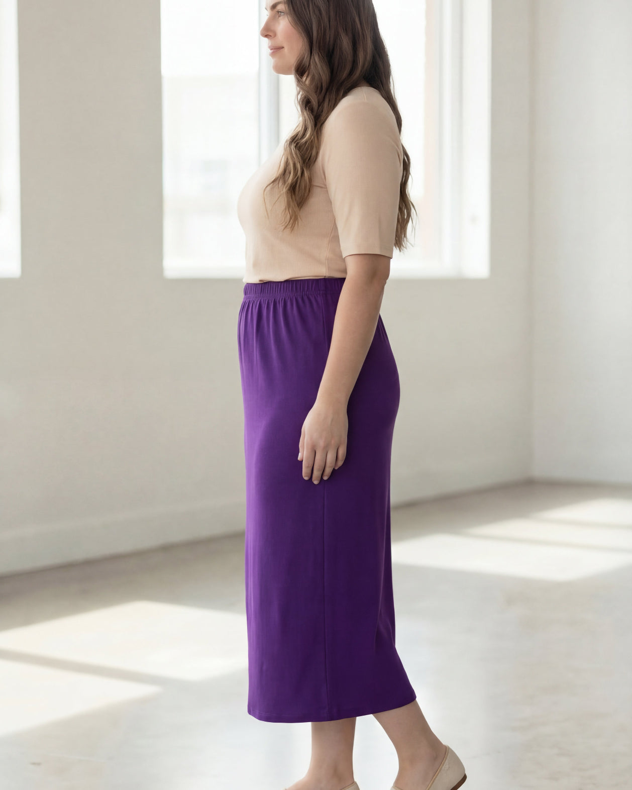 Model wearing Nuggles® 34" Classic Skirt in Royal Purple