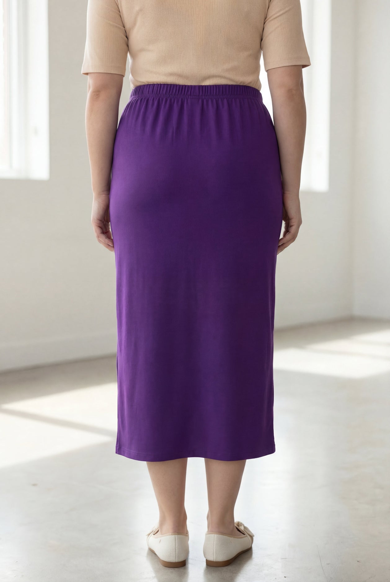 Model wearing Nuggles® 34" Classic Skirt in Royal Purple