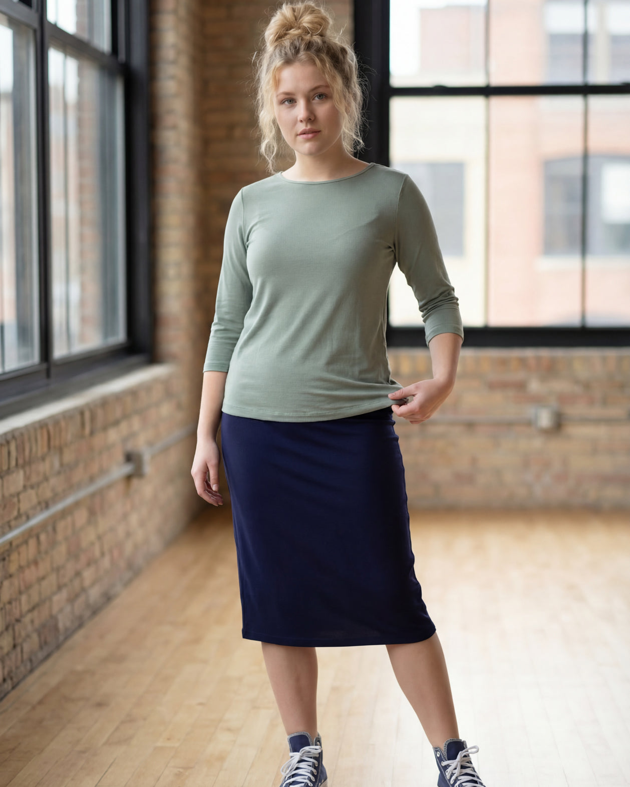 Model wearing the Nuggles® Essential 3/4 Tee in seafoam green