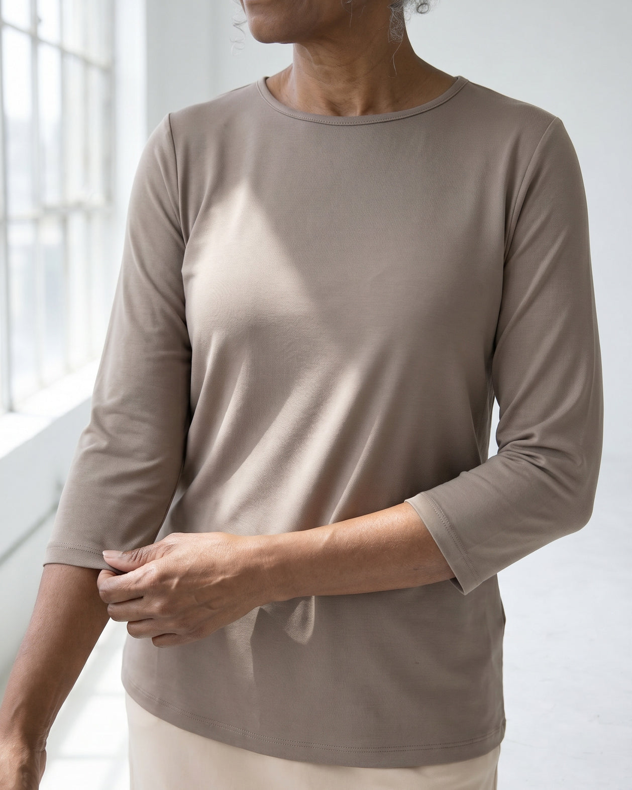 Model wearing Nuggles® Half Sleeve Essential Tee in Taupe
